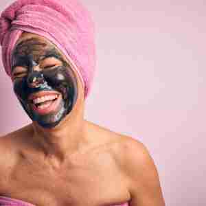 Woman laughing with face mask