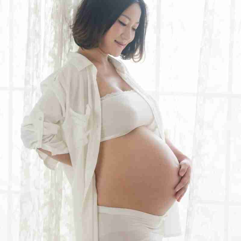 skin changes during pregnancy. beautiful pregnant women holding her belly